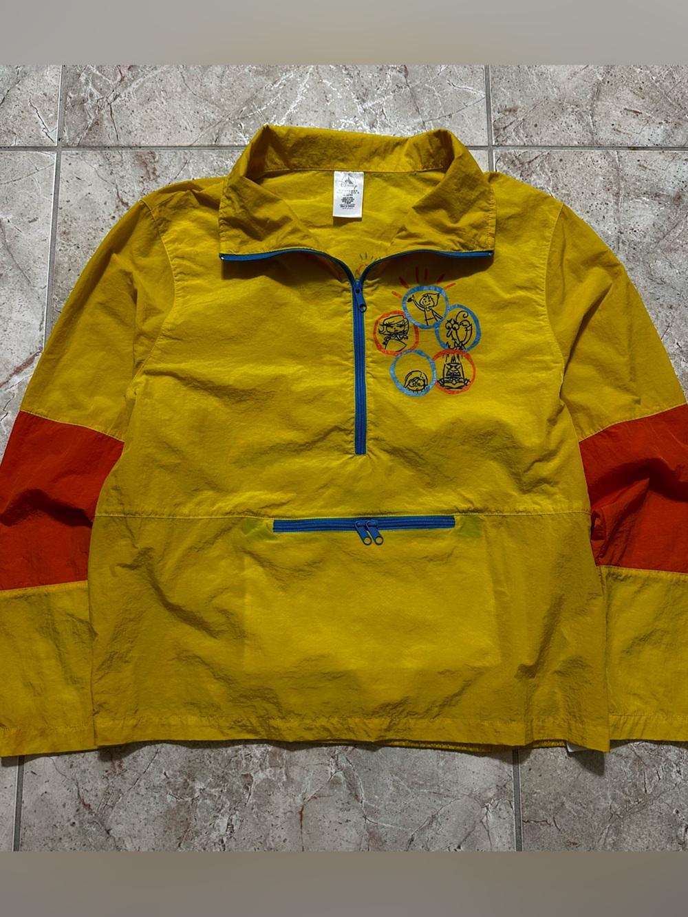 Yellow and orange Disney Pixar Inside Out windbreaker